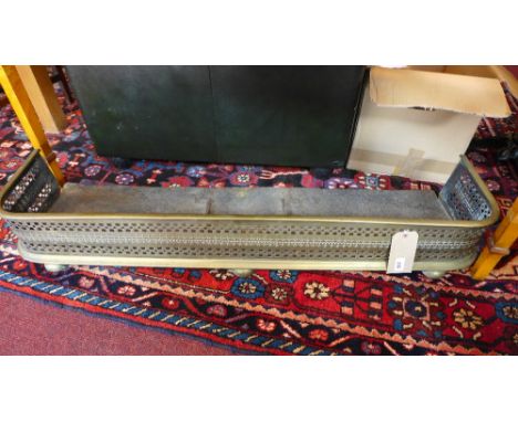 A Regency brass pierced fender 