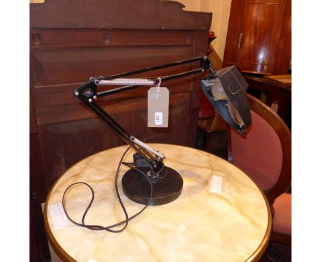 A Vintage black anglepoise adjustable desk lamp with magnifying shade 
