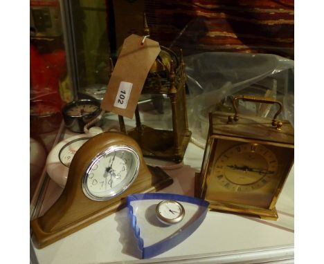 A brass lantern clock for restoration together with a carriage clock and other clocks