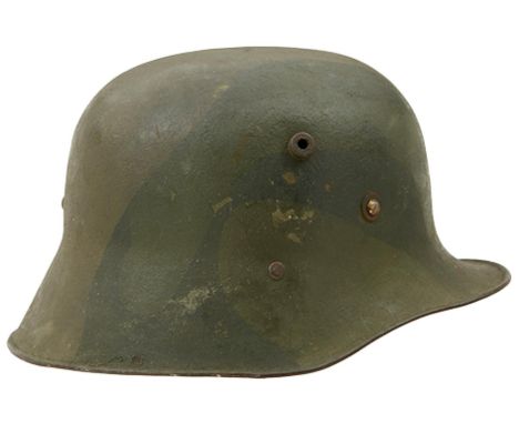 A FIRST WAR PERIOD GERMAN STEEL HELMET, fitted with the M24 liner, finished in textured green tones, together with a grey pai