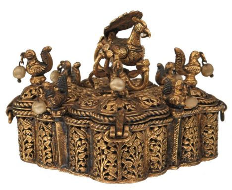 AN 18TH CENTURY INDIAN GOLD OVER SILVER PANDAN OR BETEL NUT BOX, of lobed square form and divided in to four lidded compartme