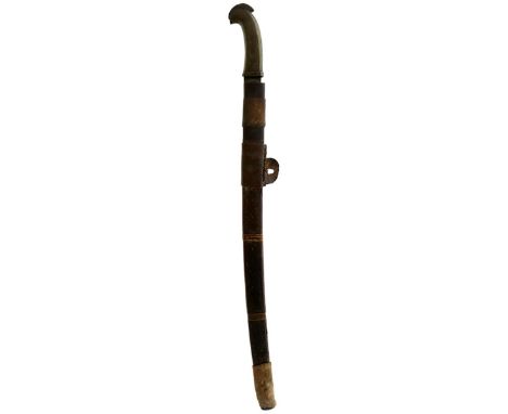 A 19TH CENTURY SOUTH EAST ASIAN TIMOR TRIBAL SHORT SWORD, 57.5cm slightly curved fullered European blade, characteristic horn