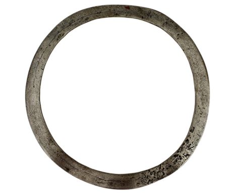 A 19TH CENTURY INDIAN THROWING RING OR CHAKRAM, 21.25cm diameter body tapering to the edge.