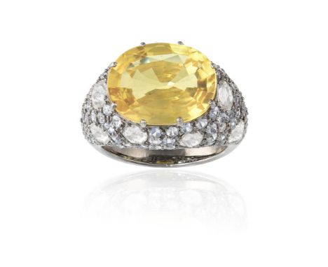 A COLOURED SAPPHIRE AND DIAMOND RINGThe cushion mixed-cut yellow sapphire, weighing approximately 9.00cts, within a surround 