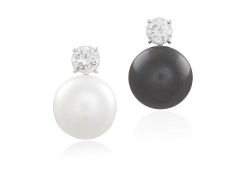 A PAIR OF CULTURED PEARL AND DIAMOND EARCLIPSEach button-shaped cultured pearl, one of white tint measuring approximately 14.