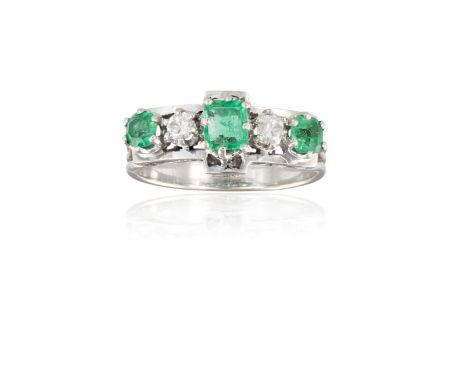 AN EMERALD AND DIAMOND RINGClaw-set with three step-cut emeralds alternating with two old round brilliant-cut diamonds, to a 