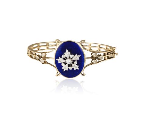 A VICTORIAN ENAMEL AND DIAMOND BANGLEThe oval blue enamel slightly bombé plaque with a centrally-set brilliant and single-cut