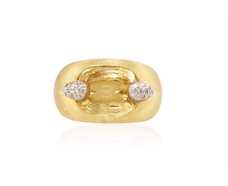 A YELLOW SAPPHIRE AND DIAMOND DRESS RINGThe collet-set cushion-shaped yellow sapphire, weighing approximately 11.50cts, betwe