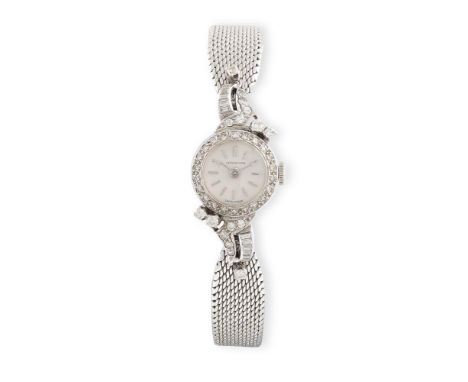 A LADY'S DIAMOND AND GOLD COCKTAIL WATCH, BY LONGINESThe 17-jewel Cal-320 manual movement, silvered dial with applied baton h