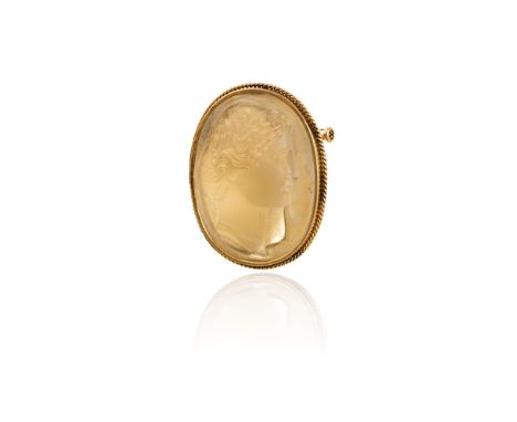 A LATE 19TH CENTURY CITRINE CAMEO BROOCHThe cushion-shaped light yellow citrine carved to depict the profile of a Greek godde