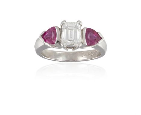 A DIAMOND AND RUBY RINGThe rectangular step-cut diamond, weighing approximately 0.95ct, within a four-claw setting, between t