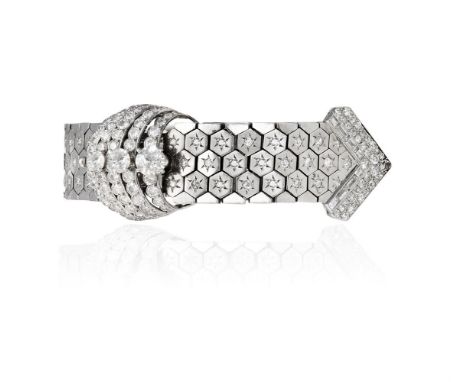 A DIAMOND-SET JARRETIERE BRACELET, CIRCA 1940The flexible body of the bracelet formed of hexagonal honeycomb-shaped links wit