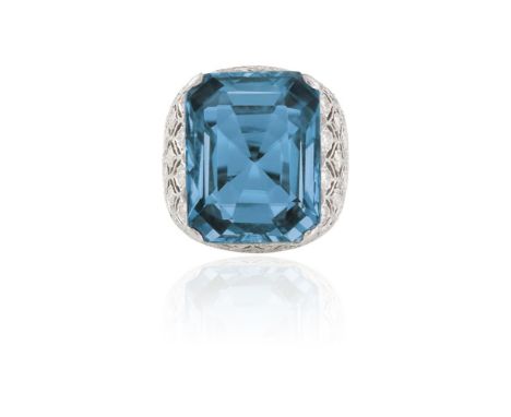 AN AQUAMARINE AND DIAMOND DRESS RING, BY MARIO BUCCELLATIThe broad band set with a rectangular-cut aquamarine, weighing appro