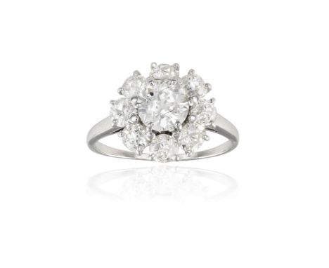 A DIAMOND CLUSTER RING, BY BOUCHERONThe round transitional-cut diamond, weighing approximately 1.30cts, within a surround of 