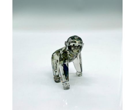 Sparkling black diamond crystal figure of a baby gorilla walking. Swarovski etched mark. Signed by artist. This item has its 