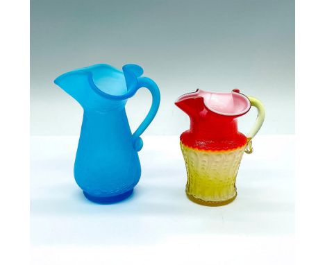 1 blue crackle glass jug, and 1 red to yellow omber embossed pitcher. Blue: 4.25"L x 3.75"W x 5"H. Red and yellow: 3.5"L x 3"