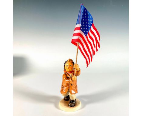 Hand painted in matte finish. Boy proudly holds a flag in hand. Includes an American flag, a German flag, and the flag of Eur
