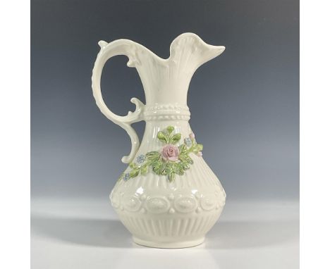 A beautiful, Irish porcelain pitcher in a cream glazed finish with left sided handle. This pitcher is decorated with an embos