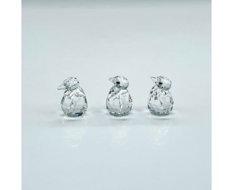 Three miniature clear faceted crystal figures of baby penguins. Swarovski mark. This item has its original box: 2.5"H x 3.25"