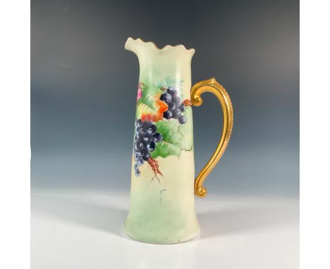 Tall pitcher with hand painted bright dark and light purple grapes; gold handle and rim. J.P.L. backstamp. Dimensions: 8.5"L 