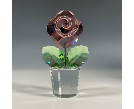 One of a kind, lead crystal flower that was part of the Happy Flowers collection. It features a clear pot, peridot green leav