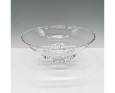 Elegant clear glass with rounded four feet. Signed Steuben to bottom base. Dimensions: 3.25"H x 8" dia.Manufacturer: SteubenC