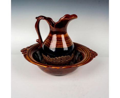 The Vintage Haeger USA Pottery Wash Basin and Pitcher Set is a stoneware set with a high brown glaze. The pitcher and basin a