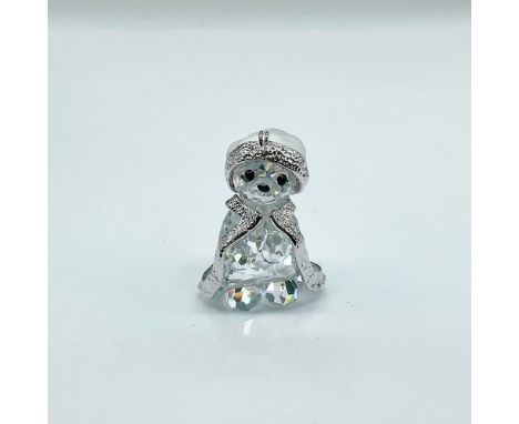 Brilliant faceted cut crystal figure of Kris Bear in a cape and frosted Santa hat. Part of the Kris Bears collection. This it