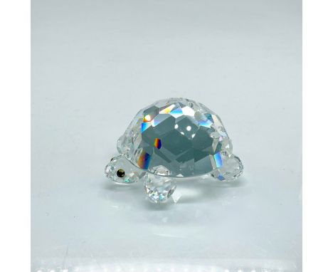 Clear faceted crystal figure of a tortoise with green eyes. Swarovski mark. Part of the Endangered Species collection. This i