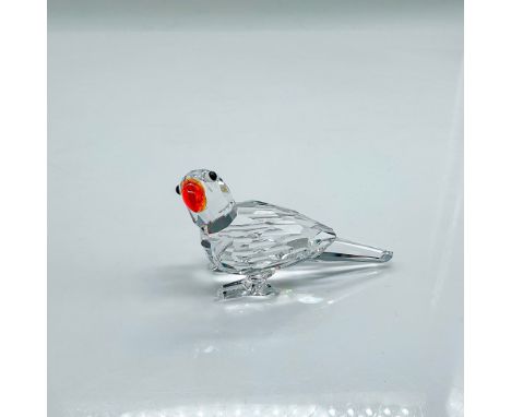 Sparkling clear faceted crystal figure of a parrot with orange beak. Part of the Feathered Beauties collection. Swarovski etc