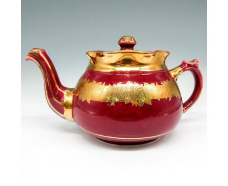 Maroon pot embellished with gilt banding design on body, neck spout and handle. Lid has gilded pull. Arthur Wood backstamp. I