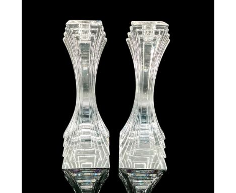 2 beautiful clear Art Deco style candlestick holders. Issued: 2007Dimensions: 3.5"L x 3.5"W x 10"HManufacturer: MikasaConditi