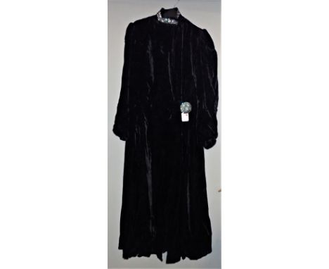A VINTAGE BLACK VELVET EVENING COAT with diamante trim to the neckline and front button fastener 
