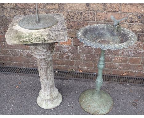 A SUNDIAL, ON A RECONSTITUTED STONE COLUMN 'MORNING GLORY' (loose gnomon), and a cast iron bird bath (2)