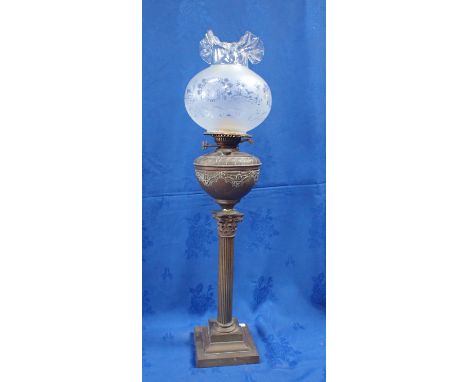 A BRASS CORINTHIAN COLUMN OIL LAMP with etched and frilled shade