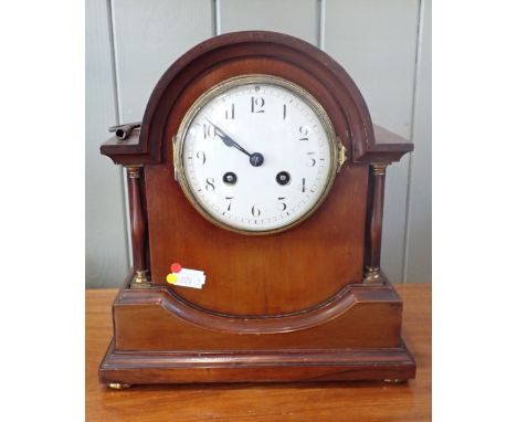 AN EDWARDIAN MAHOGANY MANTEL CLOCK with a French movement, striking on a gong 