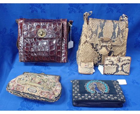 A SNAKE SKIN HANDBAG, WALLET AND COIN PURSE SET together with a crocodile skin handbag, a tapestry handbag and another simila