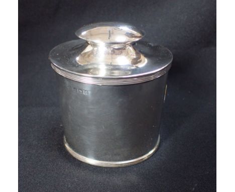 A GEORGE V SILVER OVAL TEA CADDY with matching caddy spoon fitted in lid