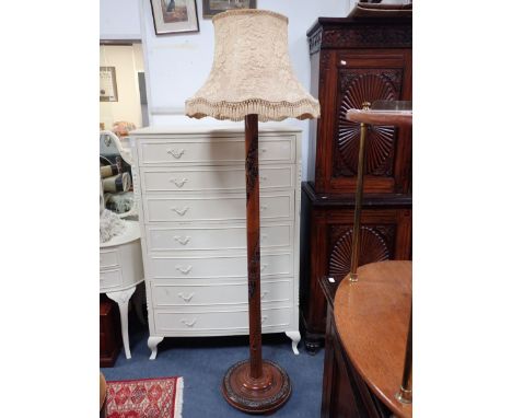 AN INDONESIAN CARVED HARDWOOD STANDARD LAMP 