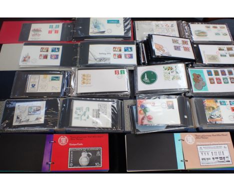 A COLLECTION OF FIRST DAY COVERS in albums