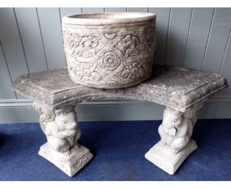 A RECONSTITUTED STONE GARDEN BENCH, WITH CAST SQUIRREL SUPPORTS 102cm wide, and a planter with Renaissance strapwork design (