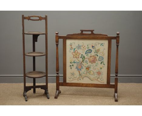 Early 20th century oak folding cake stand and an oak fire screen with floral tapestry