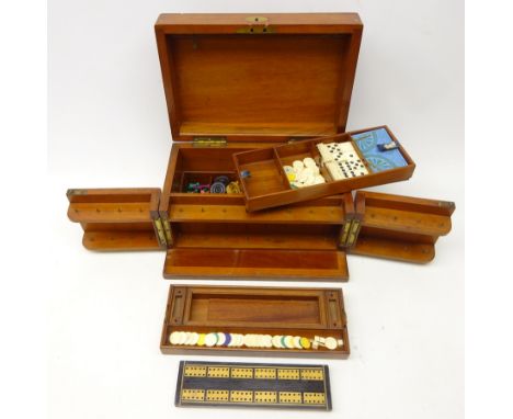 Victorian mahogany travelling games compendium with hinged cover and two swing front panels enclosing fitted interior, with c