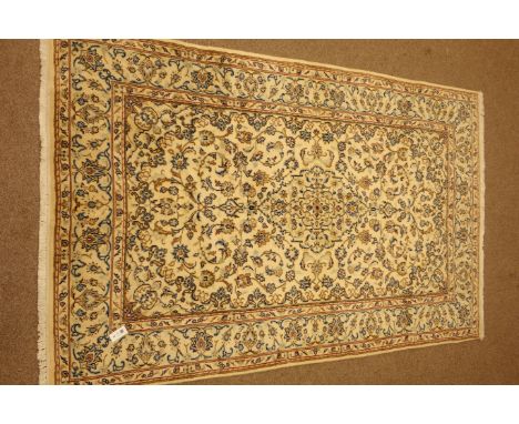 Kashan ivory ground rug, central medallion, floral and foliate field, 242cm x 150cm