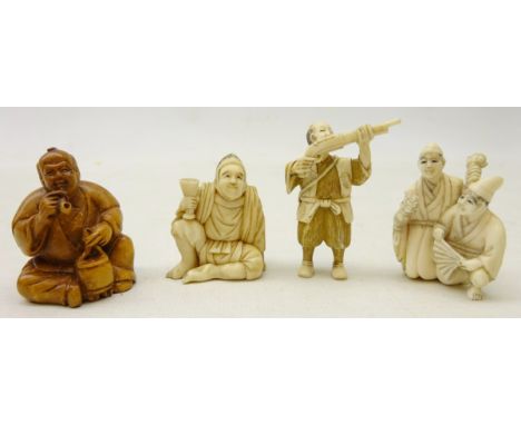 Three Japanese Meiji period Ivory Netsukes, a seated man holding a goblet, man with pistol, group of two street merchants and