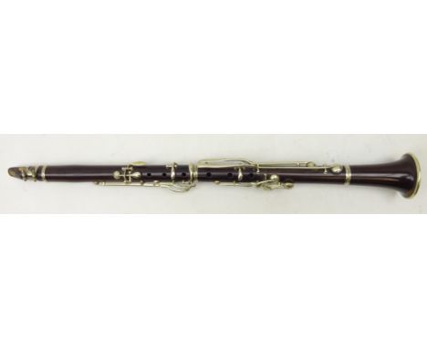 Late 19th Century hardwood clarinet with nickel mounts by Hubert Eugene Vasseilliere, marked Vasseilliere Fils a Charleville,