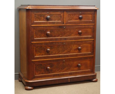 Victorian mahogany chest of two short and three long figured panel drawers with turned wooden handles, on bun turned feet, W1