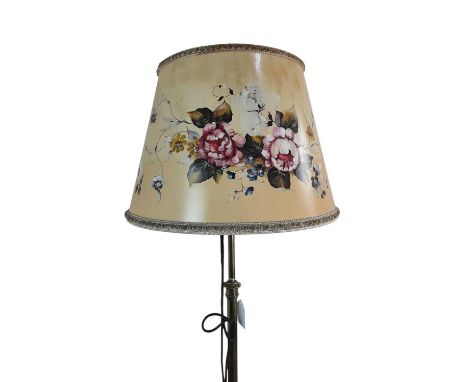 BRASS TELESCOPIC STANDARD LAMP, with circular base and with a floral decorated shade152cm high overall