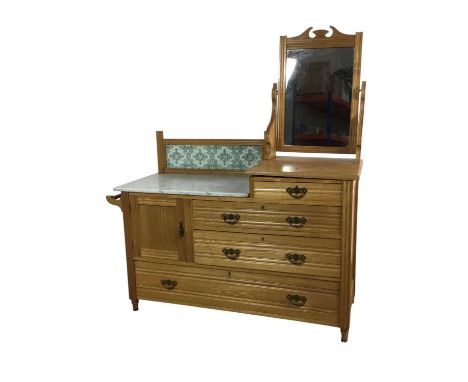 VICTORIAN ASH WASH STAND, with mirror and tile back on a base with a marble top with door and four drawers148cm high, 130cm w