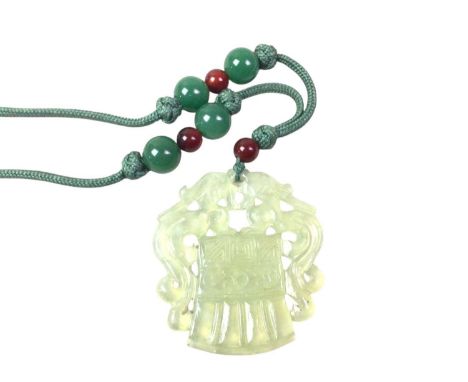 CHINESE JADE EFFECT PENDANT, LATE 20TH CENTURY  on a string fabric necklace with coloured beads